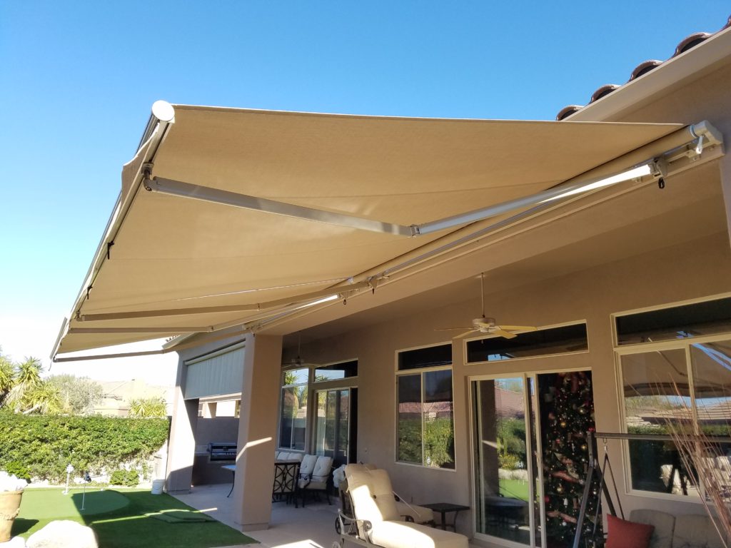 A patio awning with an umbrella attached to it.