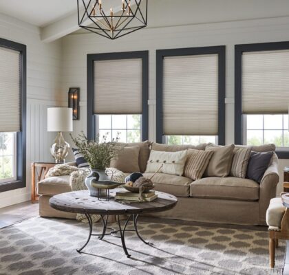Cozy living room with beige sofa and geometric coffee table.