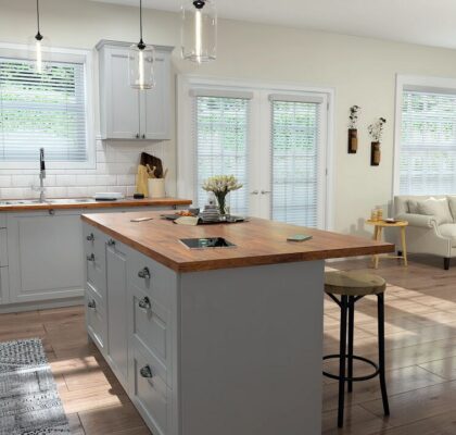 Bright modern kitchen with a wooden island and white cabinetry.