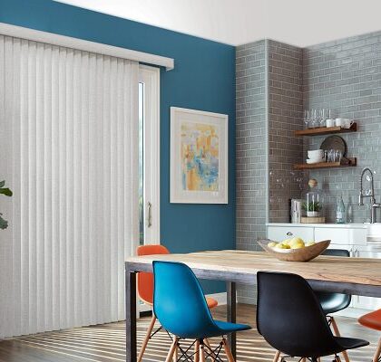 Modern dining room with colorful chairs and minimalist decor.